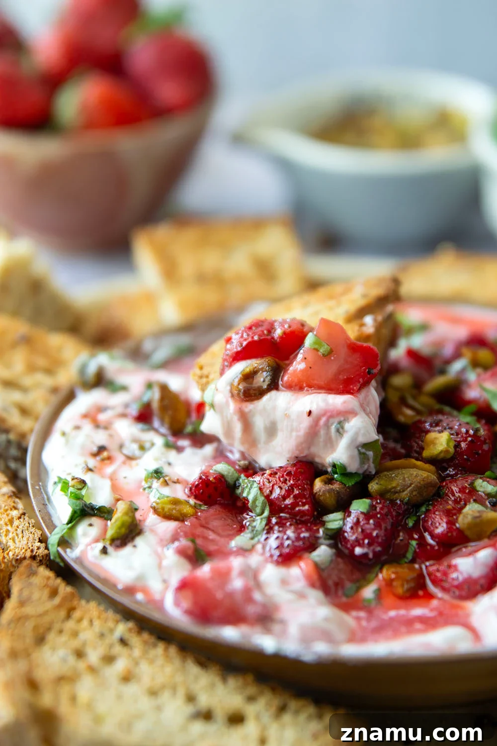 Whipped Goat Cheese with Honey-Roasted Strawberries Recipe 6 Silky whipped goat cheese is topped with juicy honey roasted strawberries and incredible served with crostini for dipping.