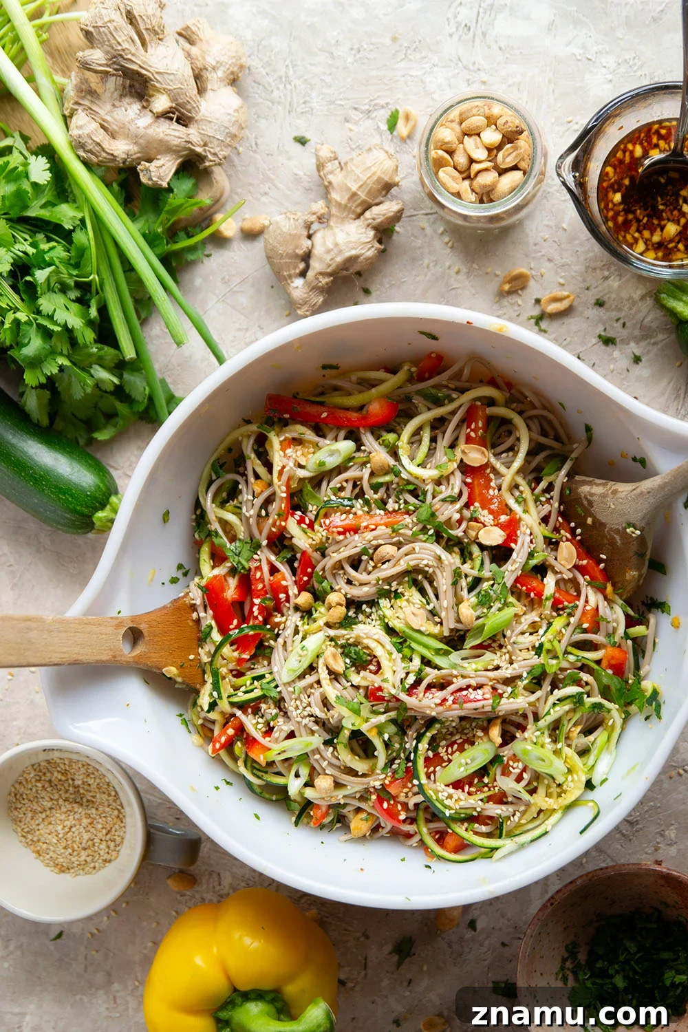 Zucchini Soba Salad with Sesame-Ginger Dressing 2 Zucchini and soba noodles are the perfect salad base in this zucchini soba noodle salad that features crunchy sweet peppers, lots of fresh herbs, and a flavorful fresh ginger sesame dressing.
