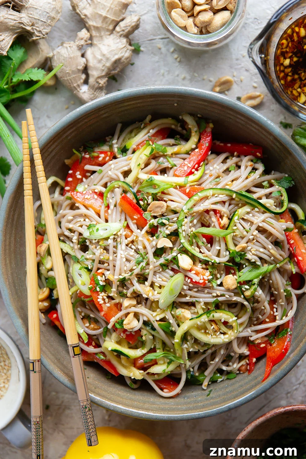 Zucchini Soba Salad with Sesame-Ginger Dressing 4 Zucchini and soba noodles are the perfect salad base in this zucchini soba noodle salad that features crunchy sweet peppers, lots of fresh herbs, and a flavorful fresh ginger sesame dressing.