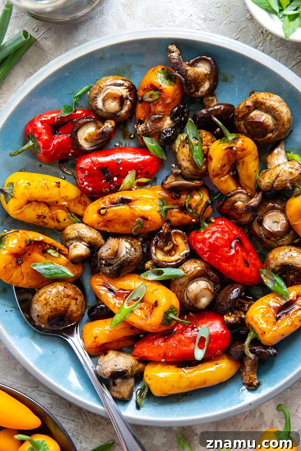 Soy-Marinated Grilled Mushrooms and Peppers 2 A mix of mushrooms and mini sweet peppers are marinated for hours in a flavorful soy marinade, grilled until tender and smoky, and topped with lots of green onions for an easy summer veggie side dish.