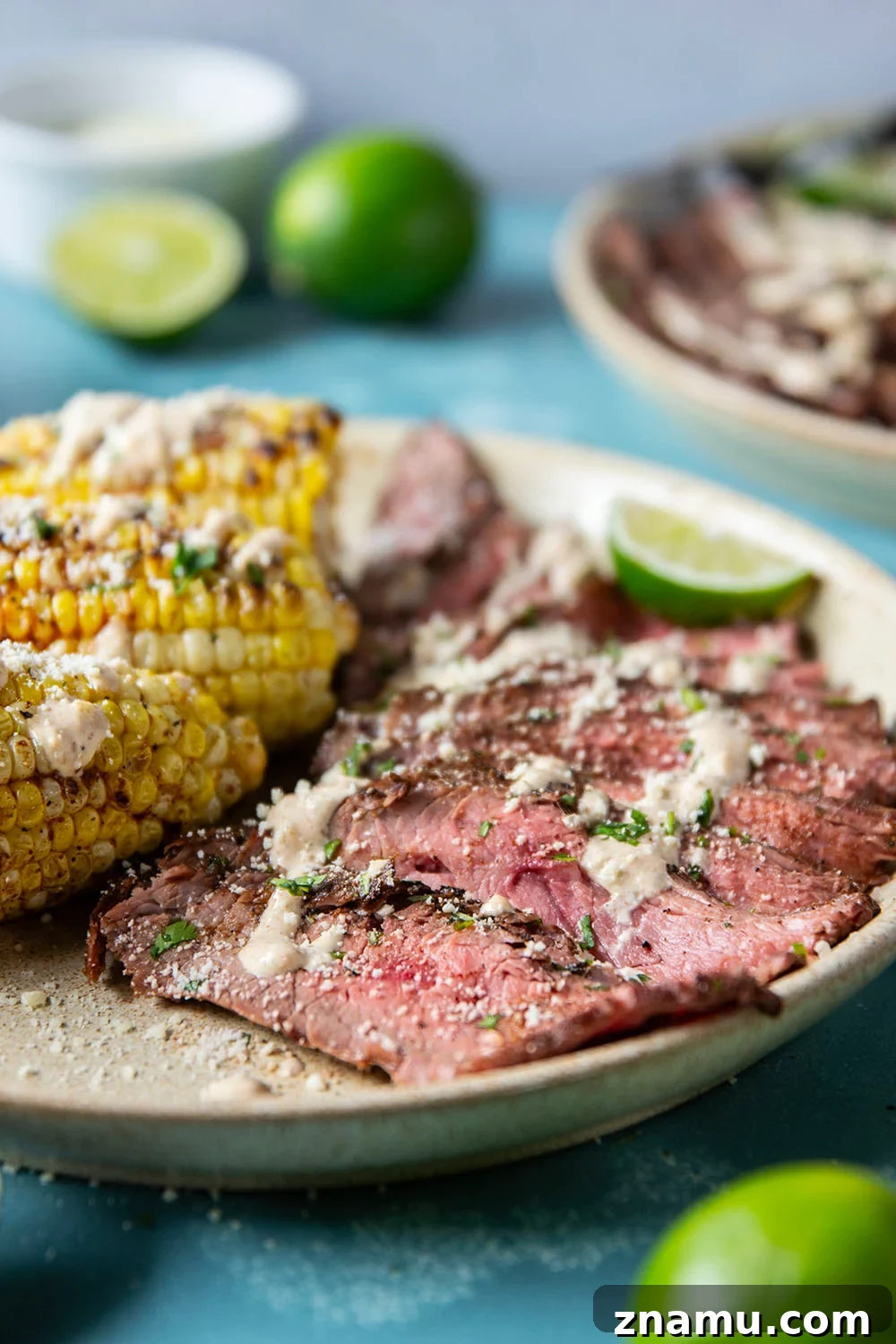 Chili-Lime Grilled Flank Steak with Sweet Corn 2 Spice-rubbed grilled flank steak and corn is an easy summer dish that pairs very well with a creamy chili lime sauce drizzled on top.