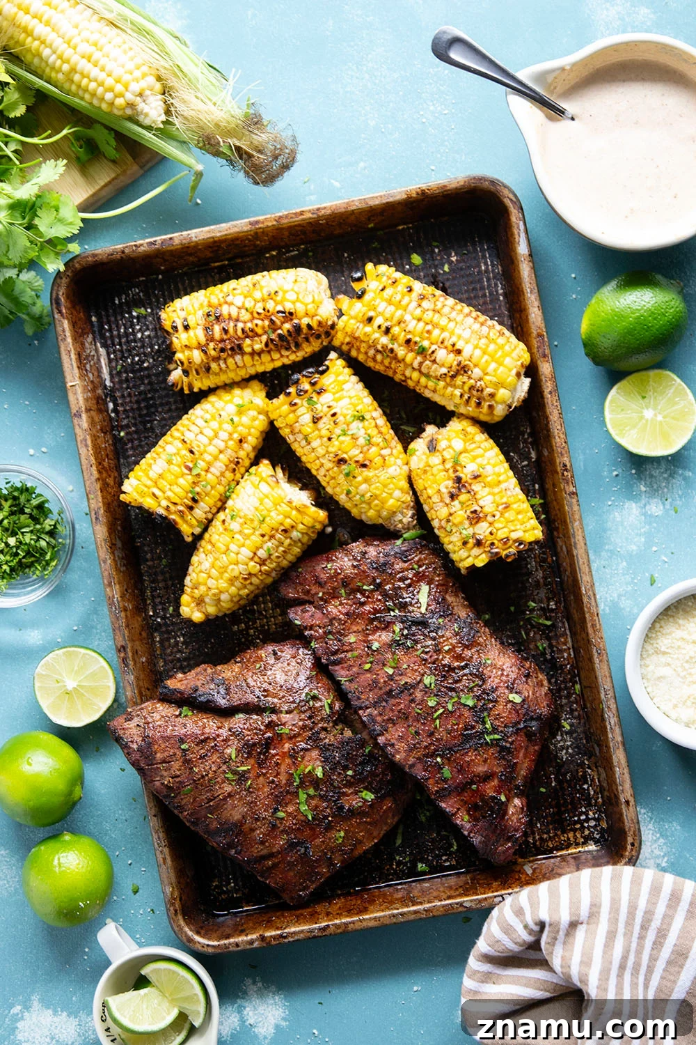 Chili-Lime Grilled Flank Steak with Sweet Corn 3 Spice-rubbed grilled flank steak and corn is an easy summer dish that pairs very well with a creamy chili lime sauce drizzled on top.
