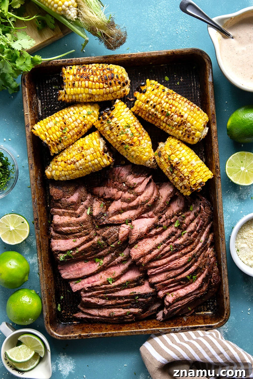Chili-Lime Grilled Flank Steak with Sweet Corn 4 Spice-rubbed grilled flank steak and corn is an easy summer dish that pairs very well with a creamy chili lime sauce drizzled on top.