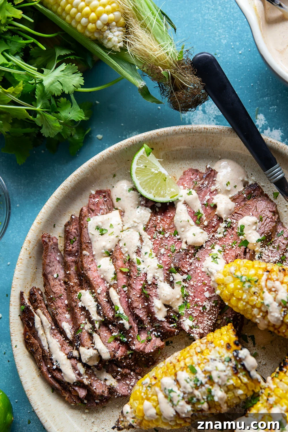 Chili-Lime Grilled Flank Steak with Sweet Corn 5 Spice-rubbed grilled flank steak and corn is an easy summer dish that pairs very well with a creamy chili lime sauce drizzled on top.