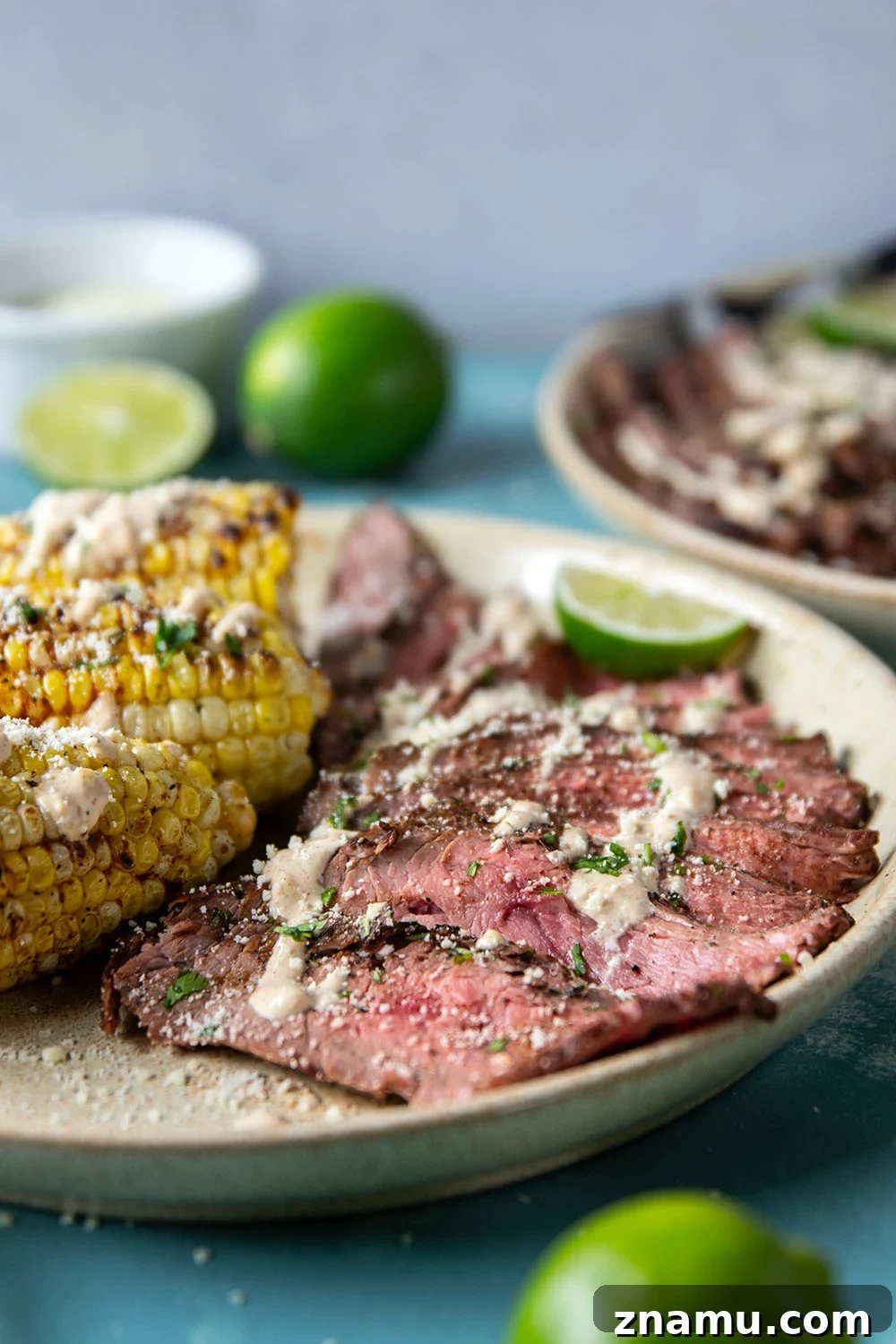 Chili-Lime Grilled Flank Steak with Sweet Corn 6 Spice-rubbed grilled flank steak and corn is an easy summer dish that pairs very well with a creamy chili lime sauce drizzled on top.