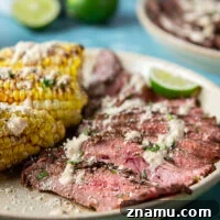 Spice-rubbed grilled flank steak and corn is an easy summer dish that pairs very well with a creamy chili lime sauce drizzled on top.
