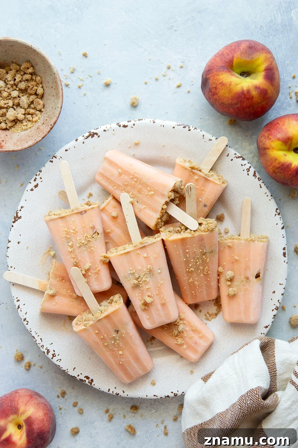 Peach popsicles with brown sugar streusel close-up