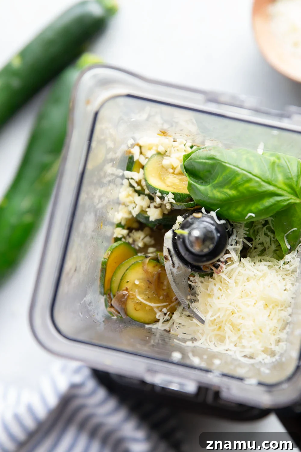 Creamy zucchini and basil sauce poured over pasta.