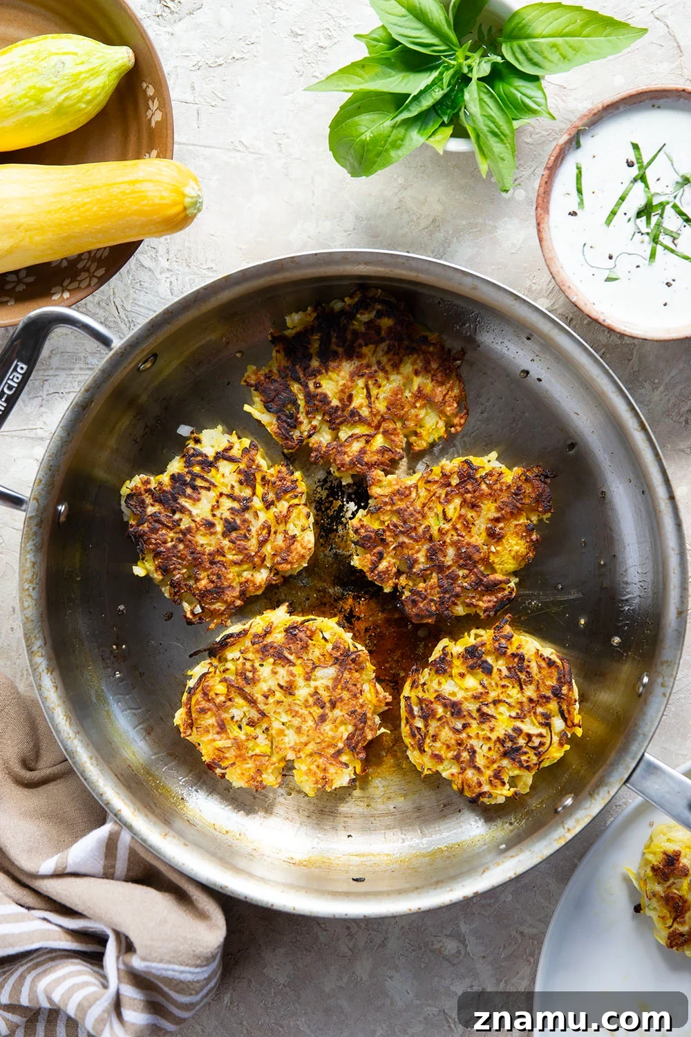 Crispy Yellow Squash Fritters with Basil Sour Cream 4 These yellow squash fritters feature perfectly crispy exteriors with a moist, flavorful texture inside. Serve them hot and crispy from the skillet with an herby fresh basil sour cream.