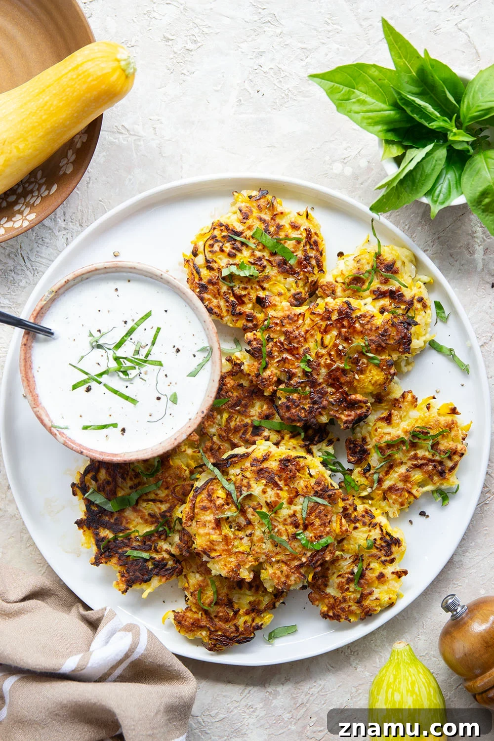 Crispy Yellow Squash Fritters with Basil Sour Cream 6 These yellow squash fritters feature perfectly crispy exteriors with a moist, flavorful texture inside. Serve them hot and crispy from the skillet with an herby fresh basil sour cream.