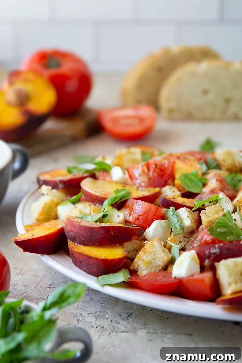 Peach Panzanella: Summer Bread Salad with Basil 5 This summery peach panzanella salad is loaded down with crisp toasted bread, juicy peach slices, sweet tomatoes, and lots of fresh basil. A flavorful shallot dressing drizzled on top adds so much flavor!