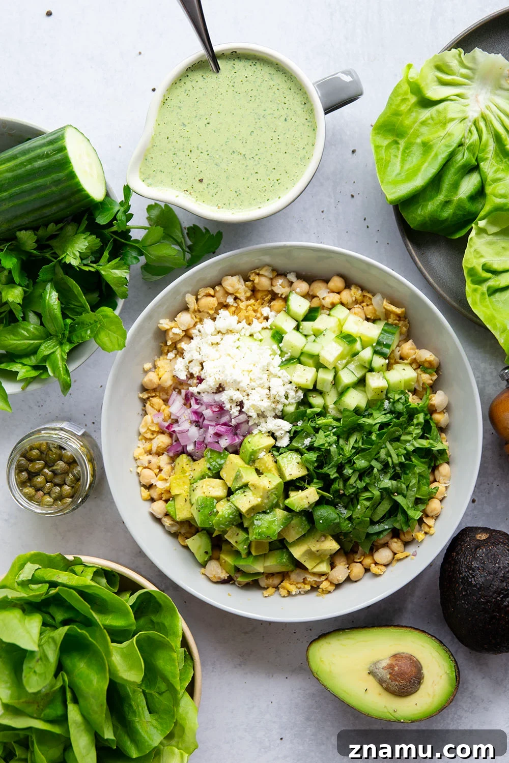Smashed chickpeas, crunchy cucumber, and an herby green goddess sauce pack tons of flavor into these light, yet filling chickpea lettuce wraps.