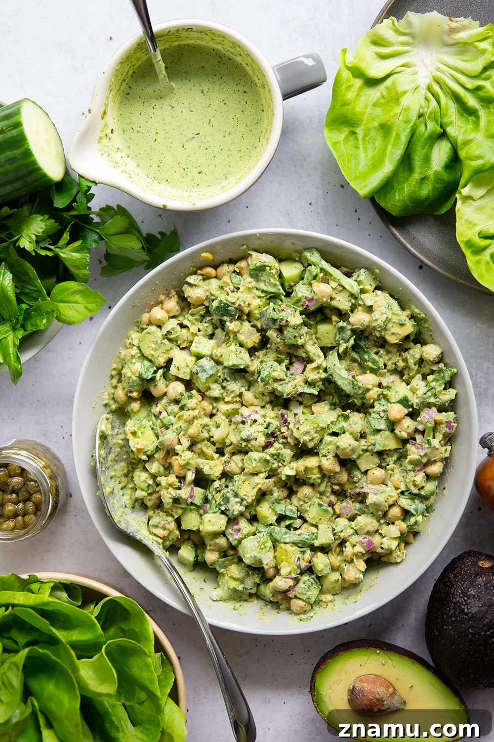 Smashed chickpeas, crunchy cucumber, and an herby green goddess sauce pack tons of flavor into these light, yet filling chickpea lettuce wraps.