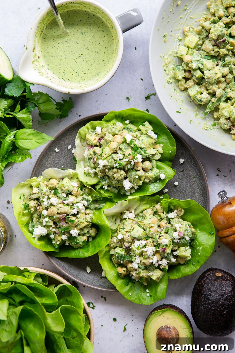 Smashed chickpeas, crunchy cucumber, and an herby green goddess sauce pack tons of flavor into these light, yet filling chickpea lettuce wraps.