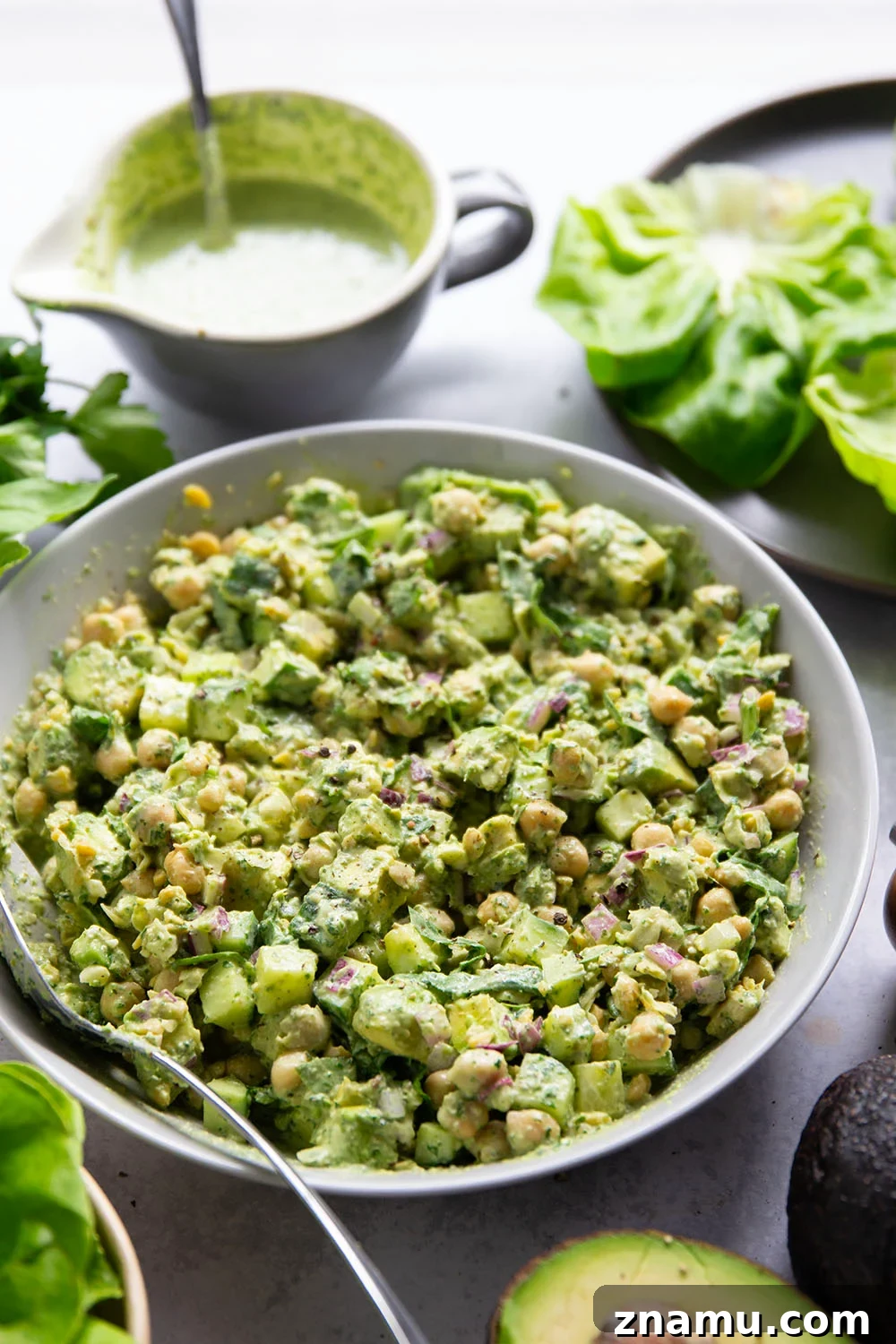 Smashed chickpeas, crunchy cucumber, and an herby green goddess sauce pack tons of flavor into these light, yet filling chickpea lettuce wraps.