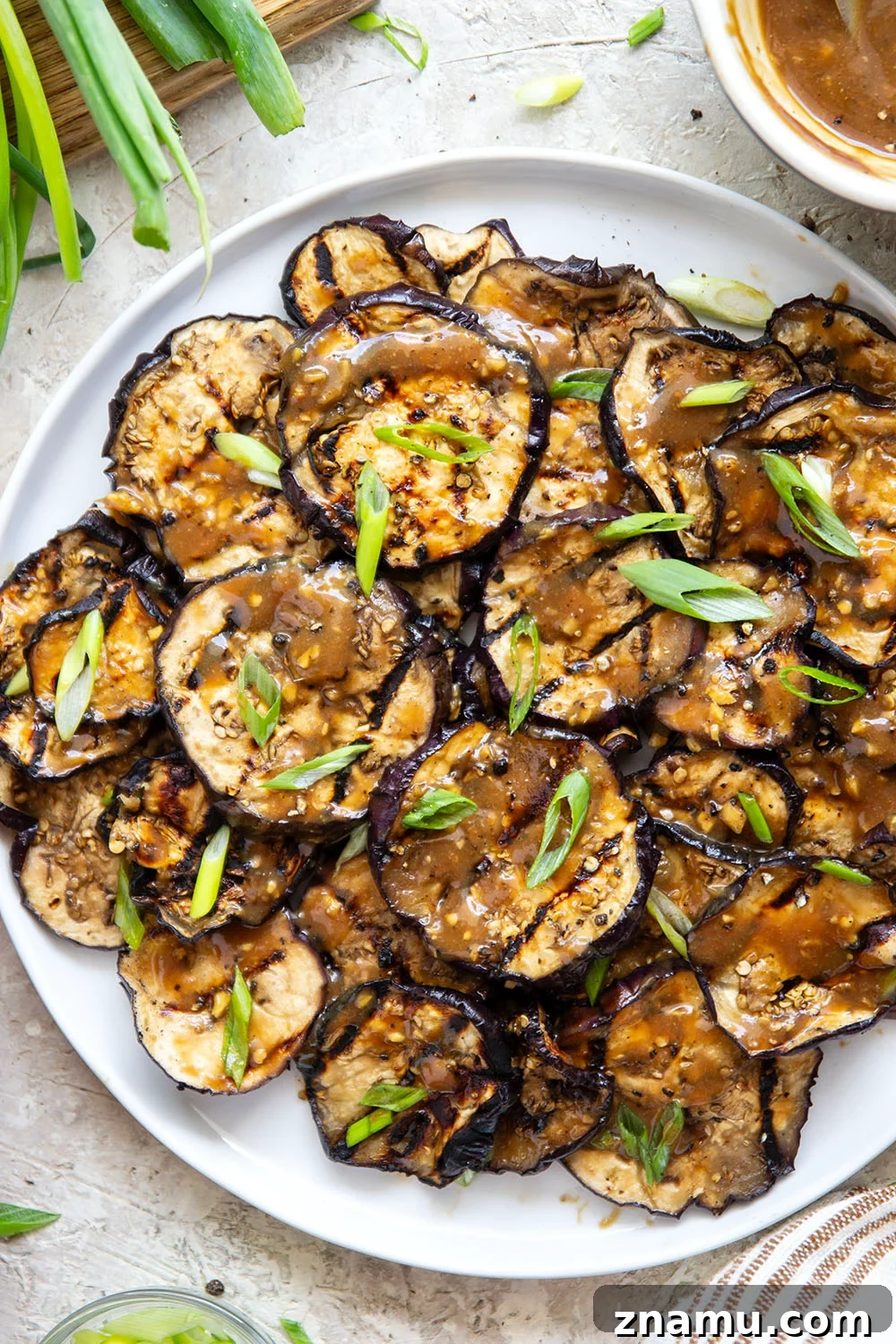 Grilled Eggplant with Miso Glaze 6 Grilled until crispy and drizzled in a flavorful miso ginger sauce, this miso grilled eggplant is the perfect way to use an abundance of eggplant and goes well with any Asian-inspired meal.