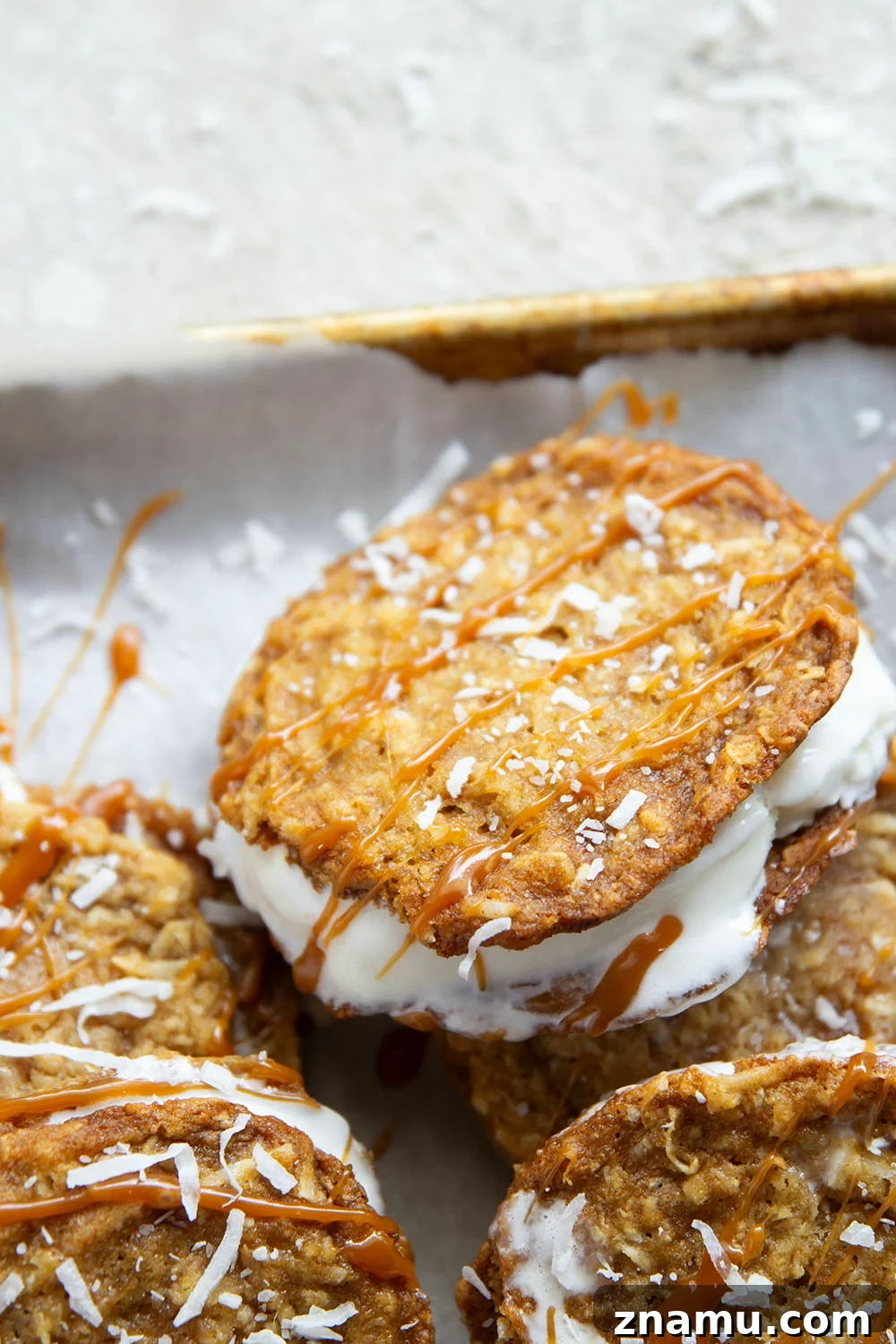 Salted Caramel Coconut Ice Cream Sandwiches 4 A base of crispy coconut cookies, homemade salted caramel, and a filling of creamy vanilla ice cream take these caramel ice cream sandwiches completely over the top!